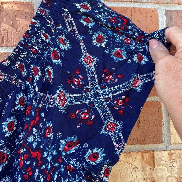 A Rewind Woman’s NWT Romper Size Xl Blue Red Floral with Pom Pom trim on hem - Picture 9 of 9